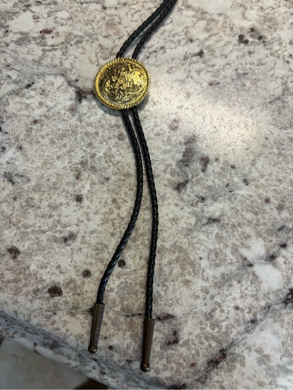 Classic Black Bolo Tie with Decorative Gold Medallion
